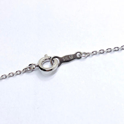 Mikimoto pearl necklace with heart motif featuring 5.4mm pearls on a 46cm silver chain