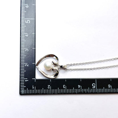 Mikimoto pearl necklace with heart motif featuring 5.4mm pearls on a 46cm silver chain