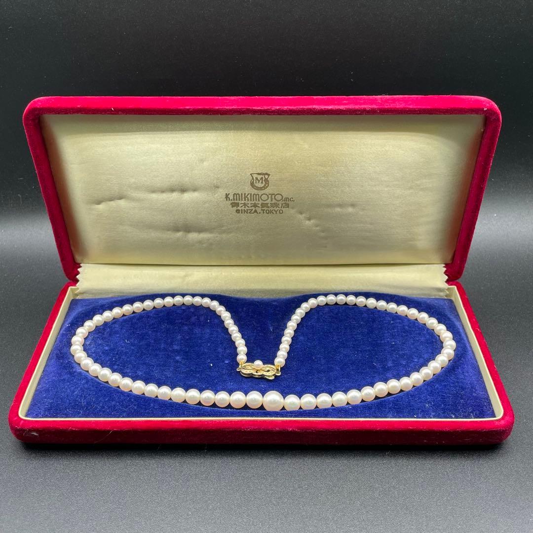 Mikimoto Akoya pearls necklace featuring white 4.5-8.5mm pearls with K14 clasp and pinkish natural interference color