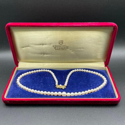 Mikimoto Akoya pearls necklace featuring white 4.5-8.5mm pearls with K14 clasp and pinkish natural interference color