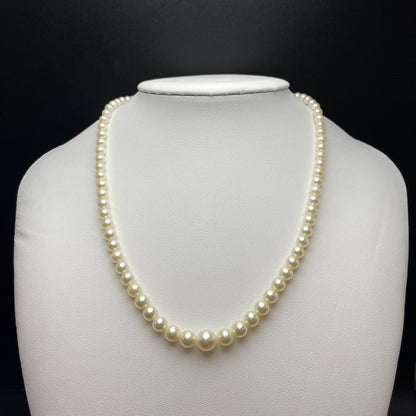 Mikimoto Akoya pearls necklace featuring white 4.5-8.5mm pearls with K14 clasp and pinkish natural interference color