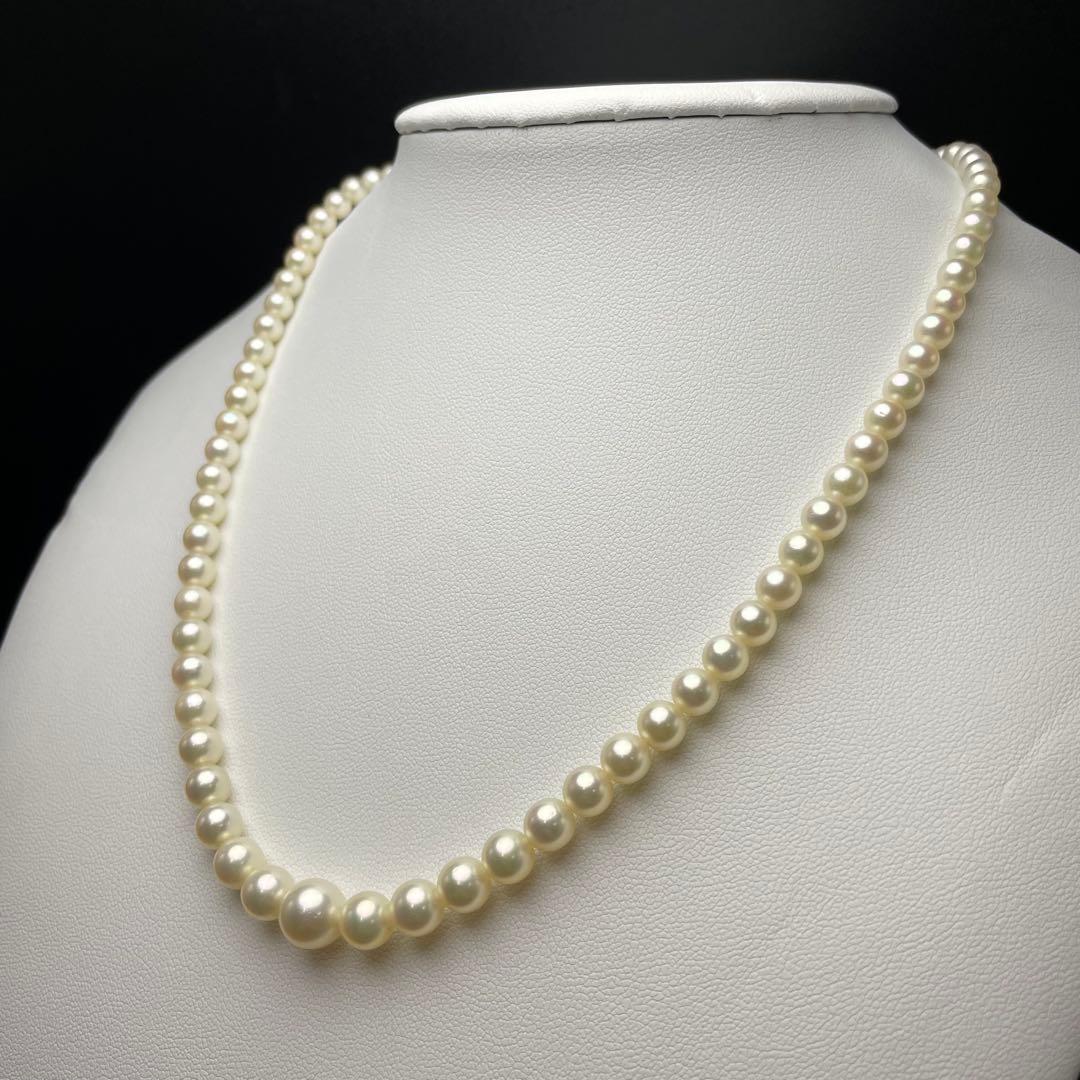 Mikimoto Akoya pearls necklace featuring white 4.5-8.5mm pearls with K14 clasp and pinkish natural interference color