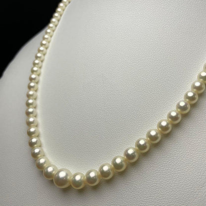 Mikimoto Akoya pearls necklace featuring white 4.5-8.5mm pearls with K14 clasp and pinkish natural interference color
