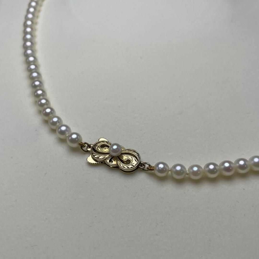 Mikimoto Akoya pearls necklace featuring white 4.5-8.5mm pearls with K14 clasp and pinkish natural interference color