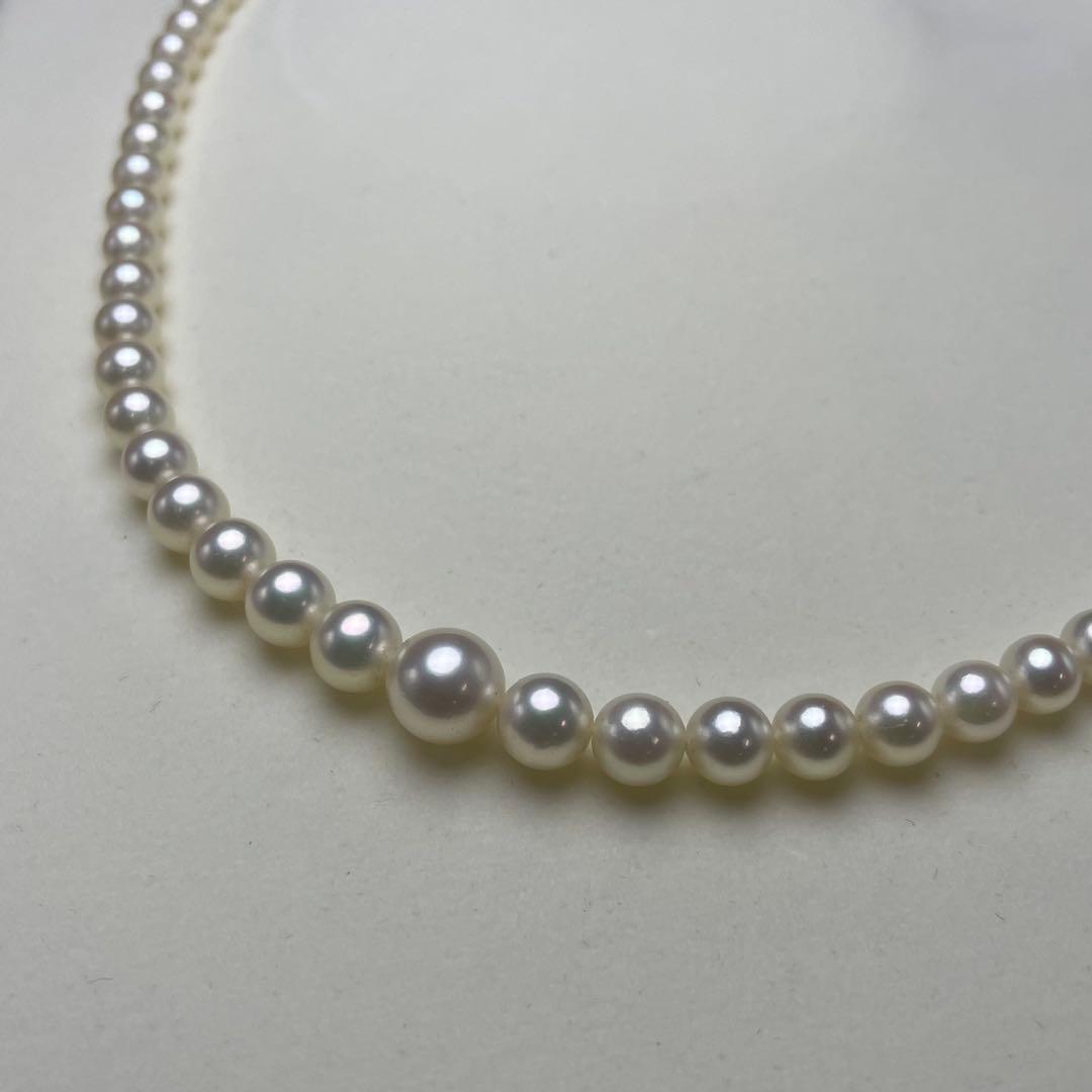 Mikimoto Akoya pearls necklace featuring white 4.5-8.5mm pearls with K14 clasp and pinkish natural interference color
