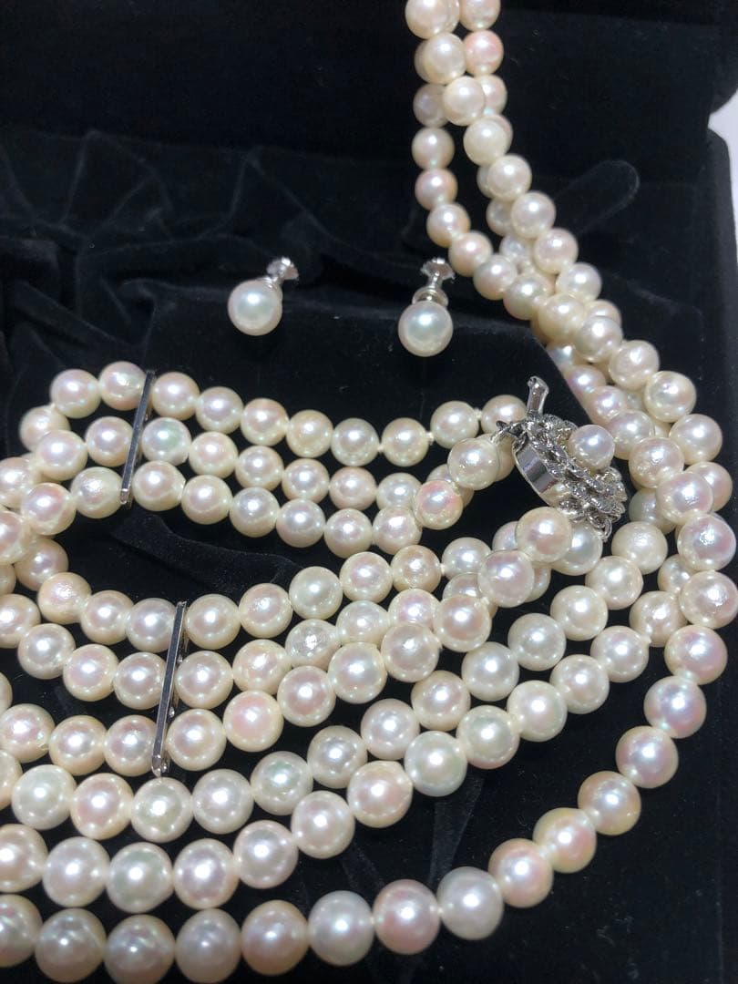 Akoya pearl silver necklace, bracelet, and earrings set with white pearls and sterling silver accents