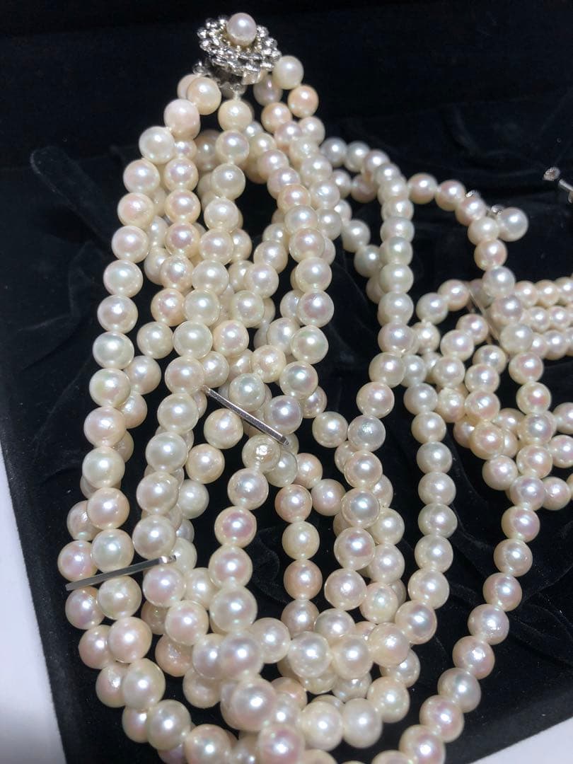 Akoya pearl silver necklace, bracelet, and earrings set with white pearls and sterling silver accents