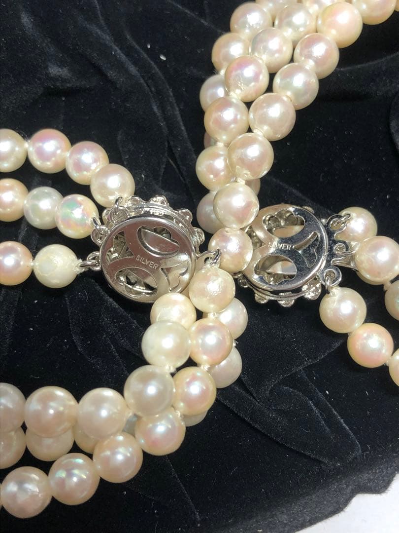 Akoya pearl silver necklace, bracelet, and earrings set with white pearls and sterling silver accents