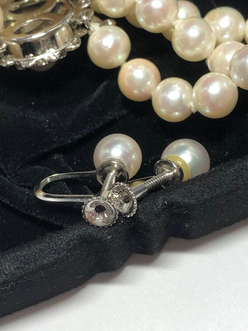 Akoya pearl silver necklace, bracelet, and earrings set with white pearls and sterling silver accents