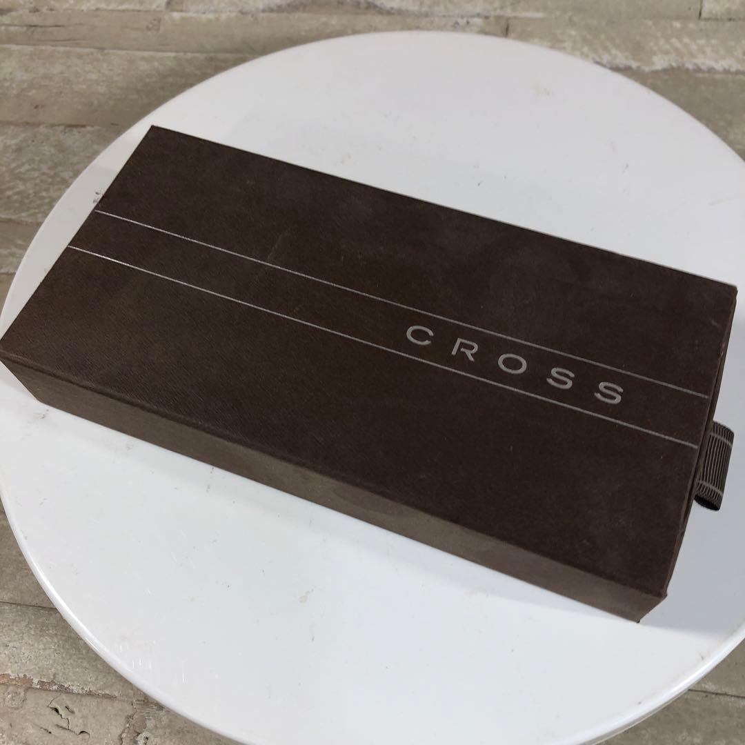 Black CROSS ballpoint pen with its protective case displayed on a white background