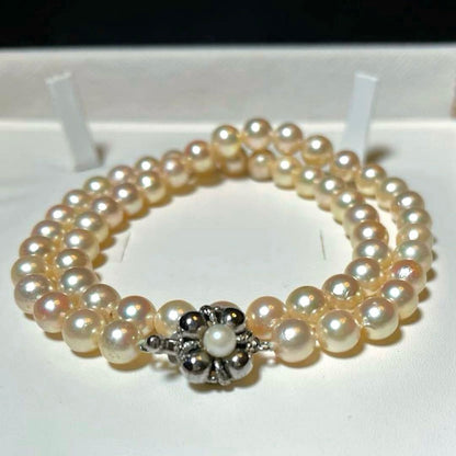 Akoya pearls necklace with 7.0-7.5mm white round pearls and silver stamp on a 42.5 cm chain