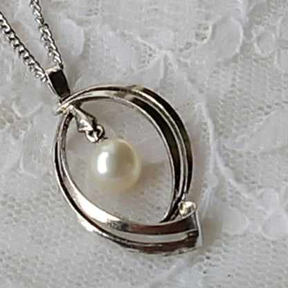 Mikimoto silver open ring with 6.4mm Akoya pearl necklace and 42cm chain displayed on white background