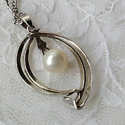 Mikimoto silver open ring with 6.4mm Akoya pearl necklace and 42cm chain displayed on white background