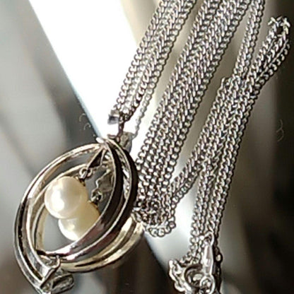 Mikimoto silver open ring with 6.4mm Akoya pearl necklace and 42cm chain displayed on white background