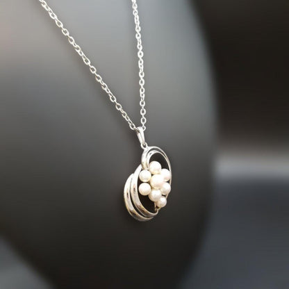 Mikimoto pearl necklace featuring grape motif pendant with 8 pearls on a silver stainless steel chain, 42 cm long