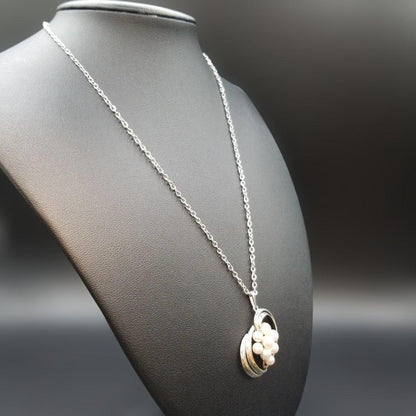 Mikimoto pearl necklace featuring grape motif pendant with 8 pearls on a silver stainless steel chain, 42 cm long