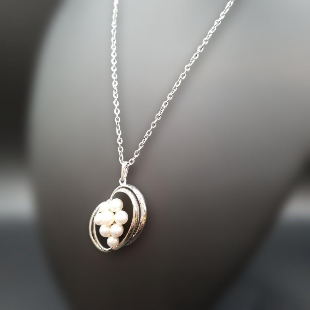Mikimoto pearl necklace featuring grape motif pendant with 8 pearls on a silver stainless steel chain, 42 cm long