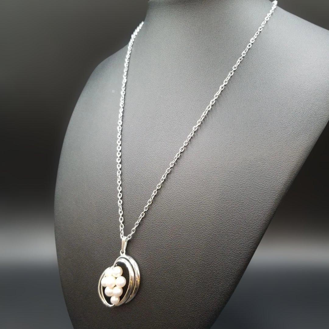 Mikimoto pearl necklace featuring grape motif pendant with 8 pearls on a silver stainless steel chain, 42 cm long