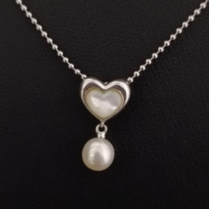 Tasaki necklace featuring a small pearl heart pendant on a 40 cm sterling silver chain