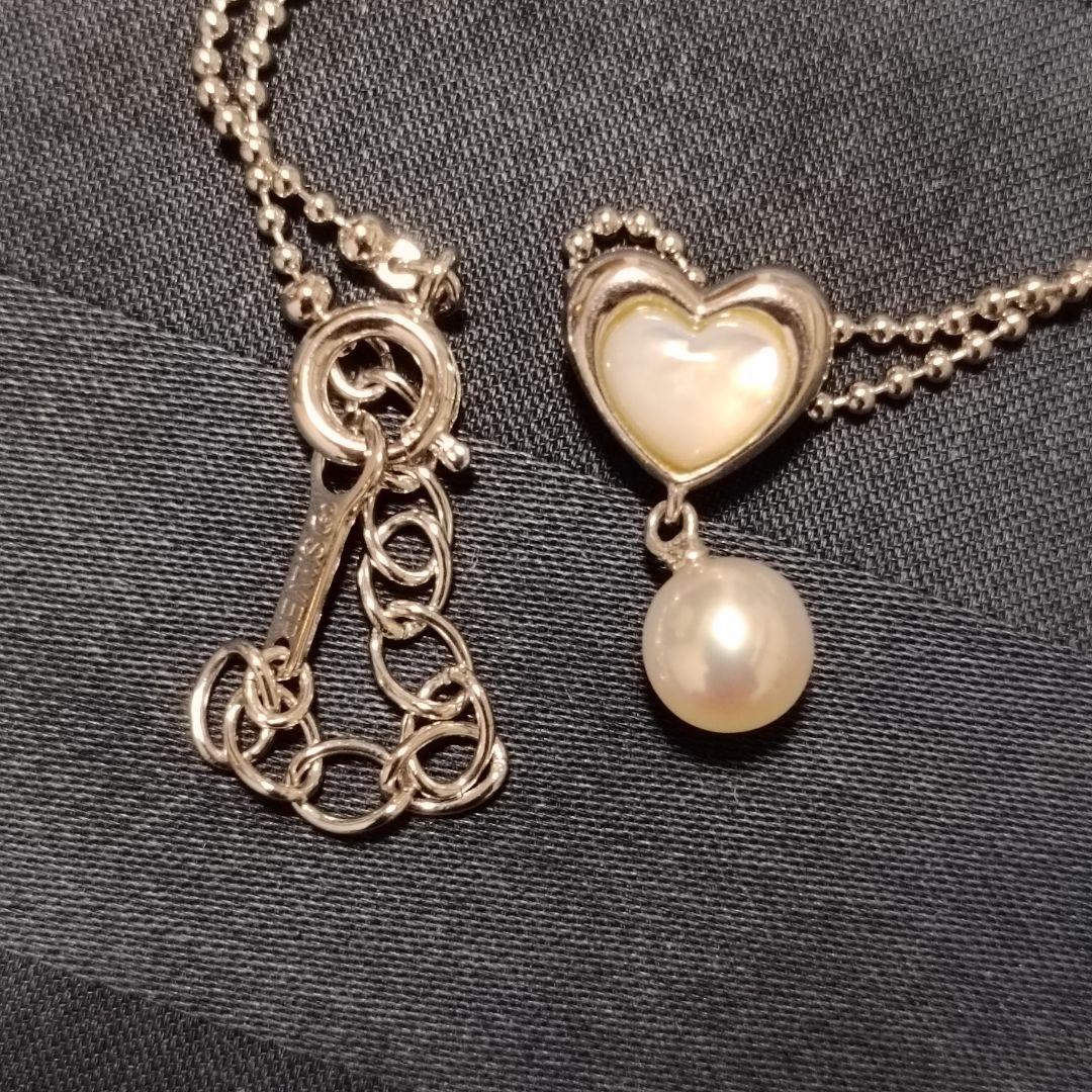 Tasaki necklace featuring a small pearl heart pendant on a 40 cm sterling silver chain