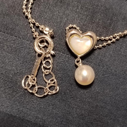 Tasaki necklace featuring a small pearl heart pendant on a 40 cm sterling silver chain