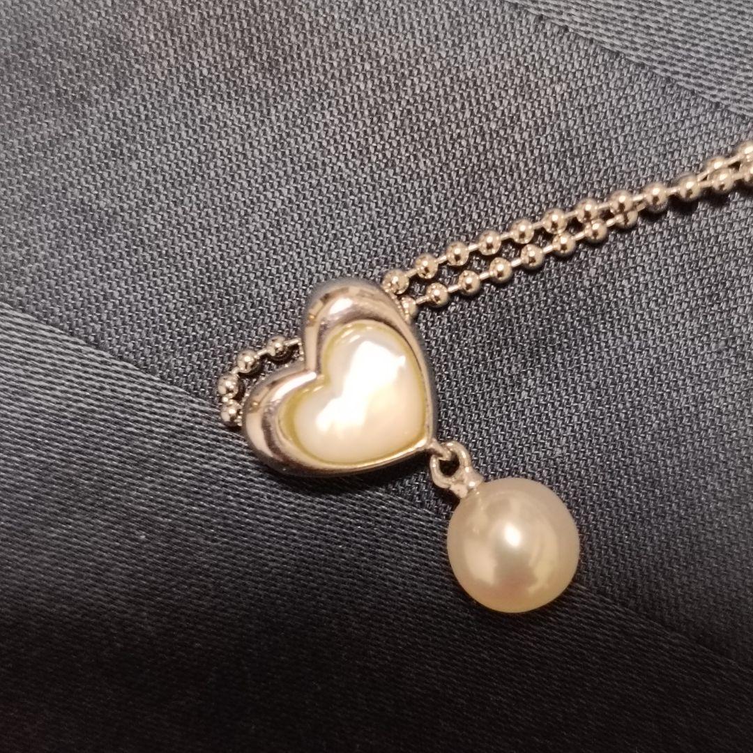 Tasaki necklace featuring a small pearl heart pendant on a 40 cm sterling silver chain