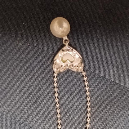 Tasaki necklace featuring a small pearl heart pendant on a 40 cm sterling silver chain