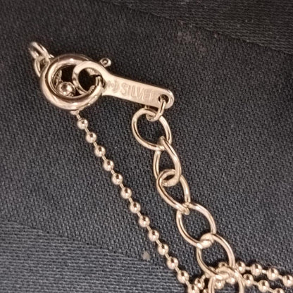 Tasaki necklace featuring a small pearl heart pendant on a 40 cm sterling silver chain