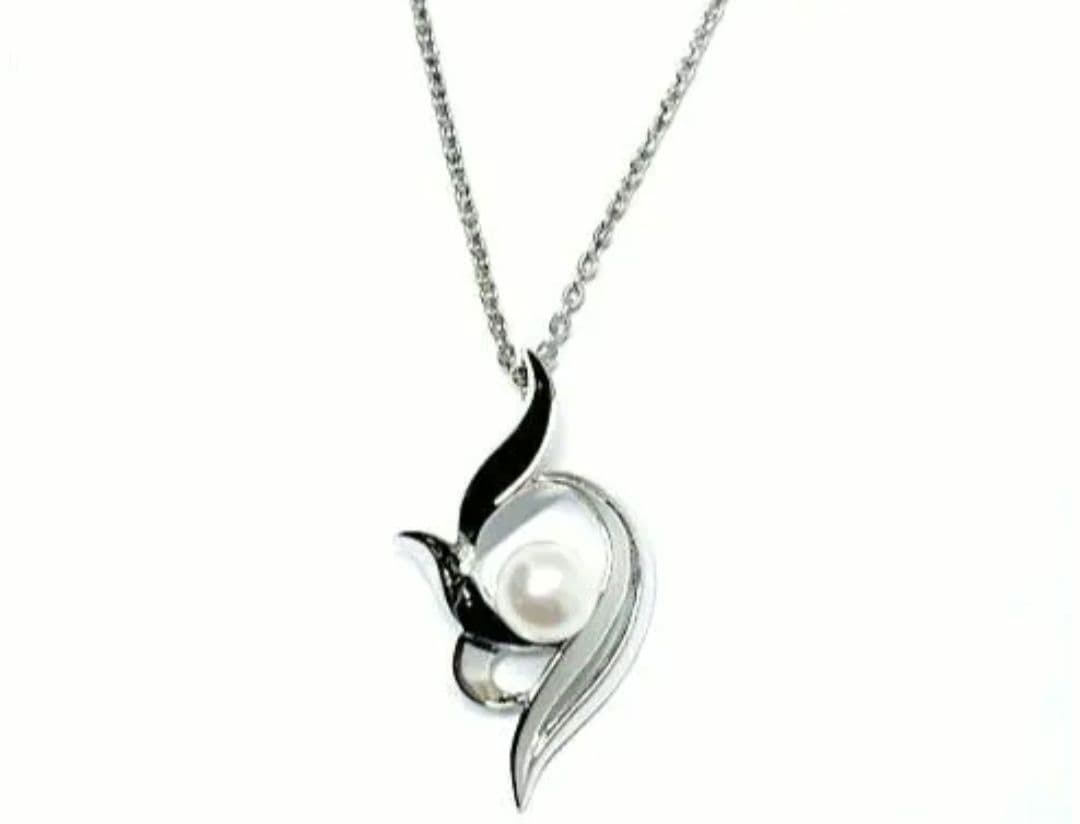 Mikimoto silver necklace with 5.9mm pearl, Nina Ricci heart motif necklace, Tocca blue handkerchief accessory and Snow Skin design