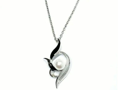 Mikimoto silver necklace with 5.9mm pearl, Nina Ricci heart motif necklace, Tocca blue handkerchief accessory and Snow Skin design
