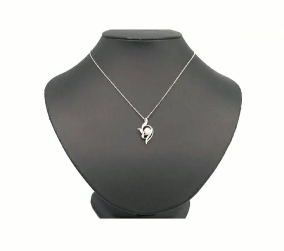 Mikimoto silver necklace with 5.9mm pearl, Nina Ricci heart motif necklace, Tocca blue handkerchief accessory and Snow Skin design