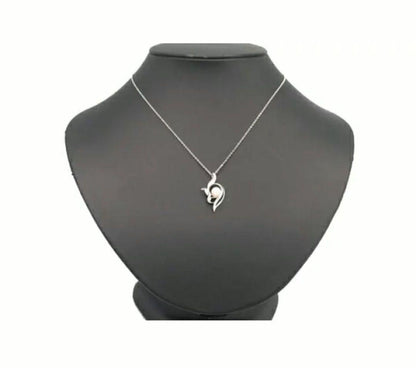 Mikimoto silver necklace with 5.9mm pearl, Nina Ricci heart motif necklace, Tocca blue handkerchief accessory and Snow Skin design