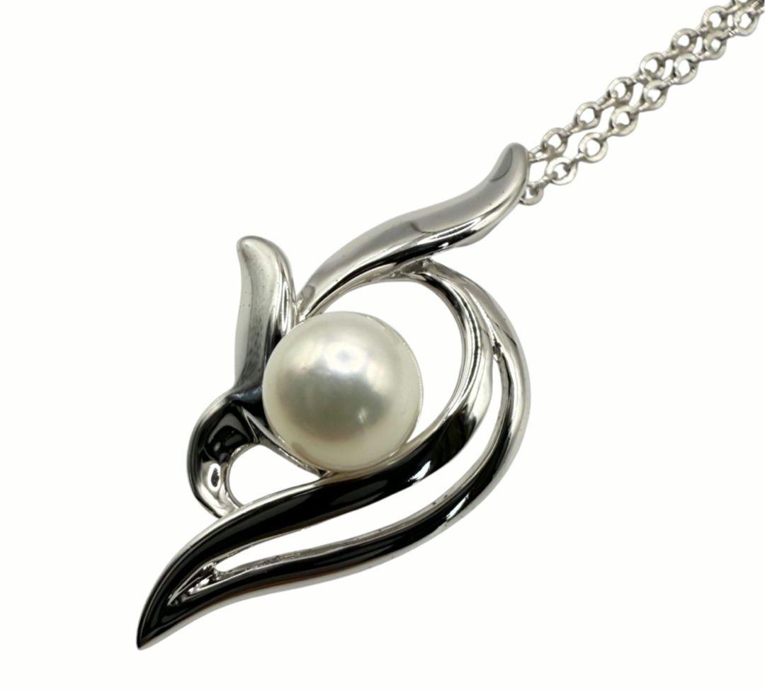 Mikimoto silver necklace with 5.9mm pearl, Nina Ricci heart motif necklace, Tocca blue handkerchief accessory and Snow Skin design