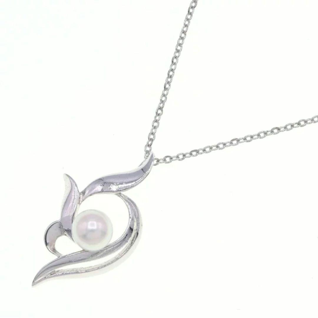 Mikimoto silver necklace with 5.9mm pearl, Nina Ricci heart motif necklace, Tocca blue handkerchief accessory and Snow Skin design
