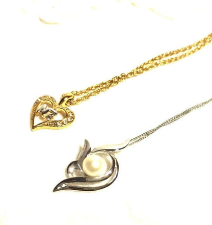 Mikimoto silver necklace with 5.9mm pearl, Nina Ricci heart motif necklace, Tocca blue handkerchief accessory and Snow Skin design