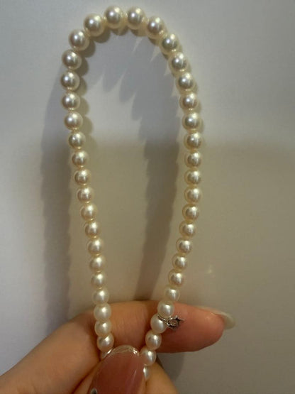 Mikimoto Akoya pearl necklace 43cm with 6.0−6.5mm pearls and silver clasp on white background