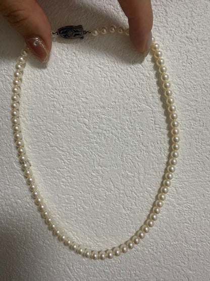 Mikimoto Akoya pearl necklace 43cm with 6.0−6.5mm pearls and silver clasp on white background