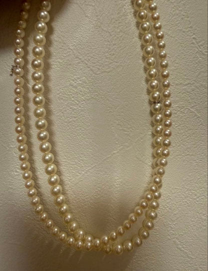 Mikimoto Akoya pearl necklace 43cm with 6.0−6.5mm pearls and silver clasp on white background