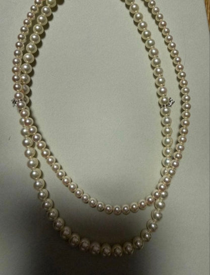 Mikimoto Akoya pearl necklace 43cm with 6.0−6.5mm pearls and silver clasp on white background