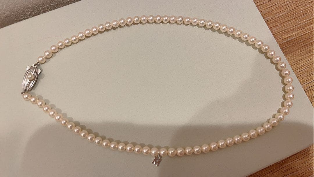 Mikimoto Akoya pearl necklace 43cm with 6.0−6.5mm pearls and silver clasp on white background