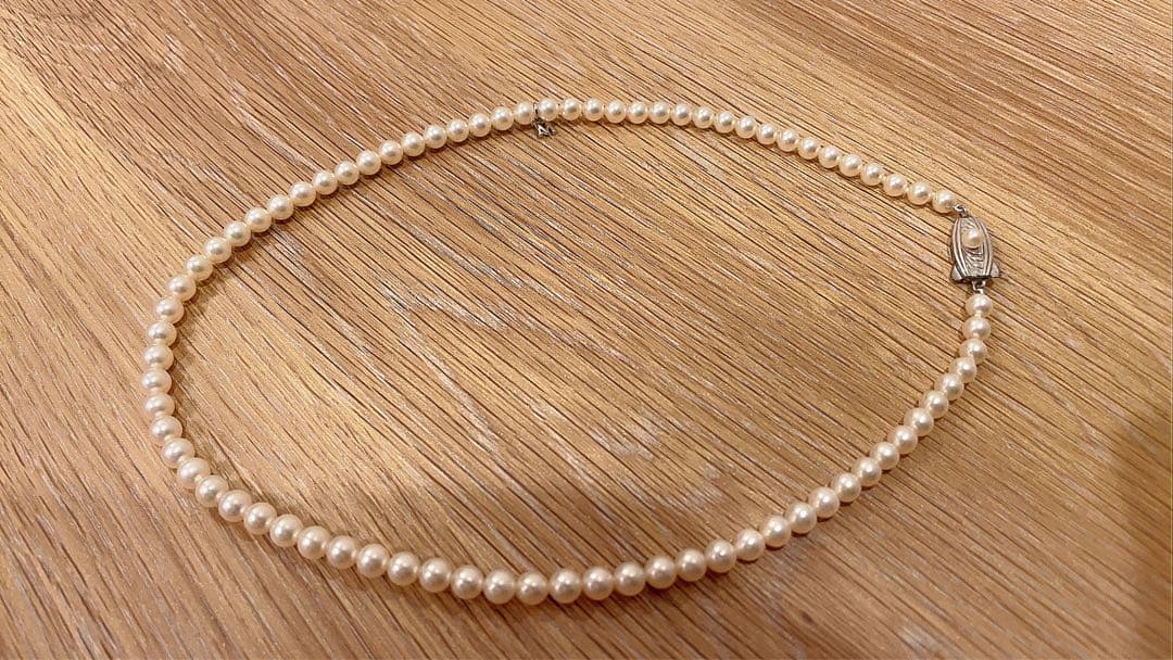 Mikimoto Akoya pearl necklace 43cm with 6.0−6.5mm pearls and silver clasp on white background