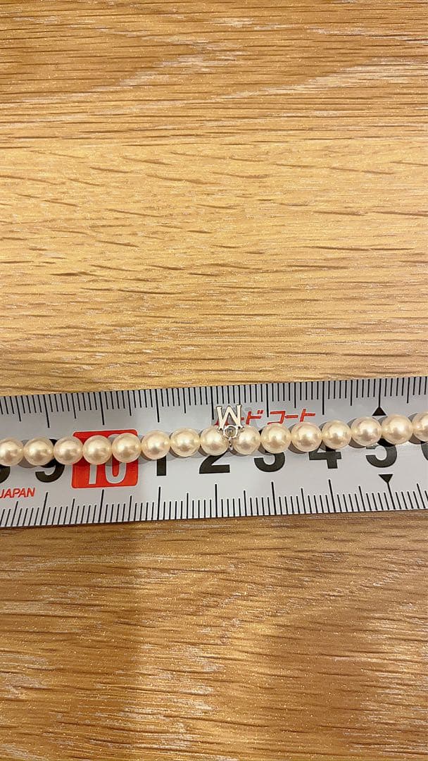 Mikimoto Akoya pearl necklace 43cm with 6.0−6.5mm pearls and silver clasp on white background