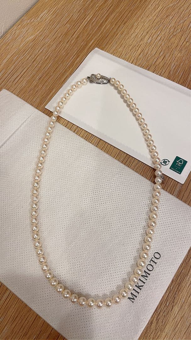 Mikimoto Akoya pearl necklace 43cm with 6.0−6.5mm pearls and silver clasp on white background