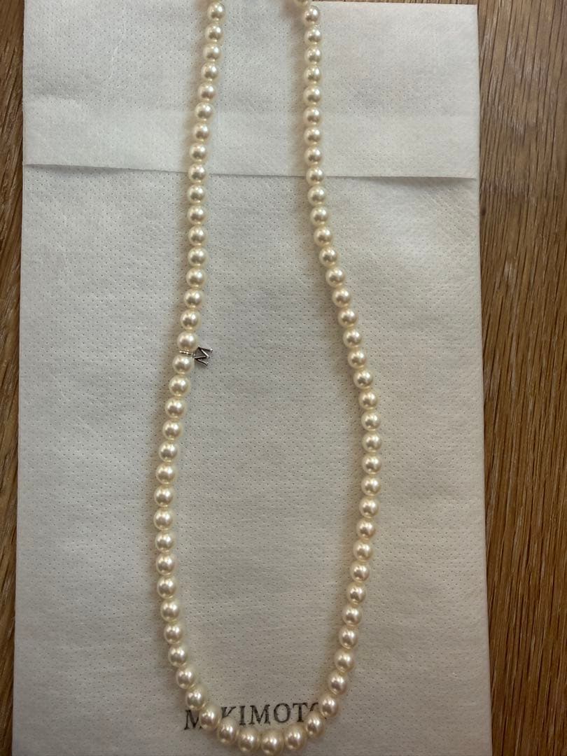 Mikimoto Akoya pearl necklace 43cm with 6.0−6.5mm pearls and silver clasp on white background