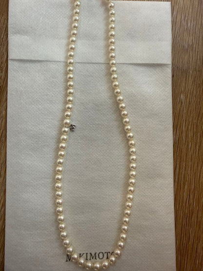 Mikimoto Akoya pearl necklace 43cm with 6.0−6.5mm pearls and silver clasp on white background