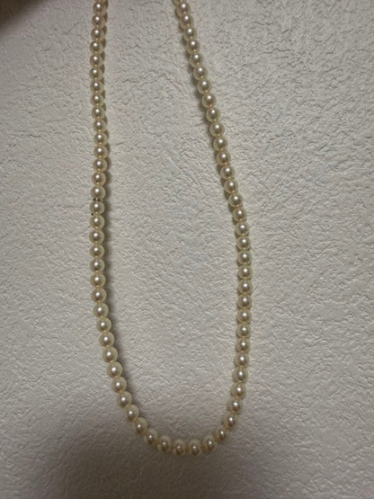 Mikimoto Akoya pearl necklace 43cm with 6.0−6.5mm pearls and silver clasp on white background