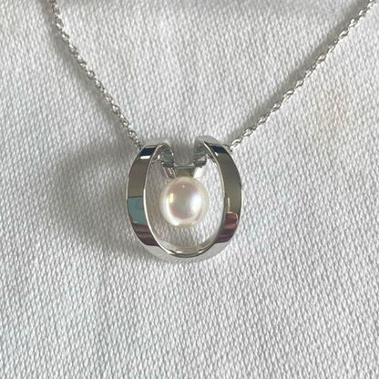 TASAKI necklace with 5mm Akoya pearl pendant in sterling silver featuring horseshoe design and chain up to 42 cm