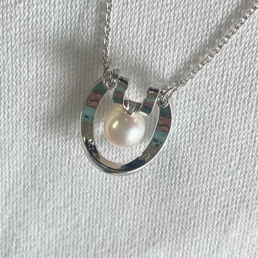 TASAKI necklace with 5mm Akoya pearl pendant in sterling silver featuring horseshoe design and chain up to 42 cm