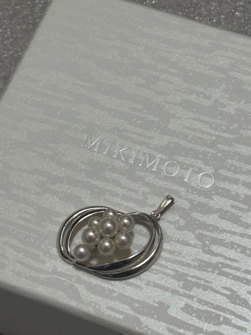 Mikimoto Pearl Pendant Top featuring 8 pearls in a circle motif with silver back stamp