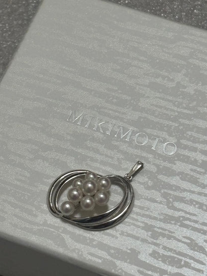 Mikimoto Pearl Pendant Top featuring 8 pearls in a circle motif with silver back stamp